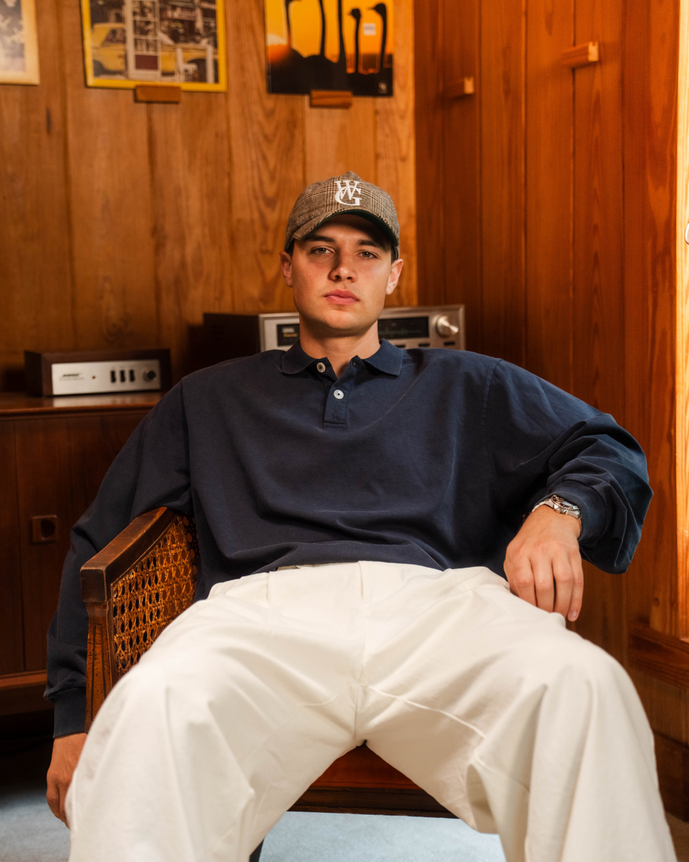 The Pro walking the fairway in the black Perfect Trouser and black mock neck, club over his shoulder